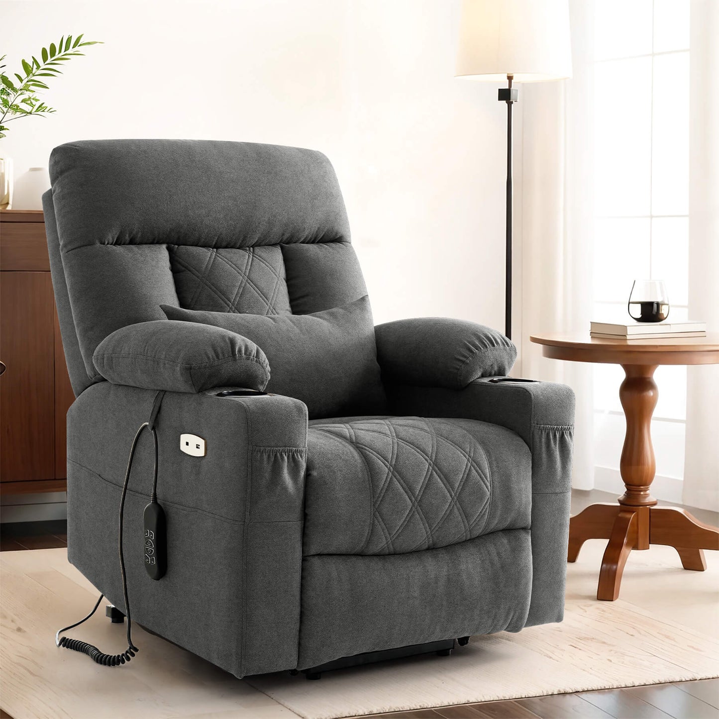 Sitting position gray fabric power recliner with lumbar pillow.