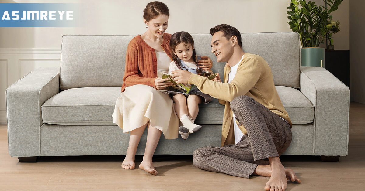 Family_of_three_sitting_on_the_couch_reading_a_book