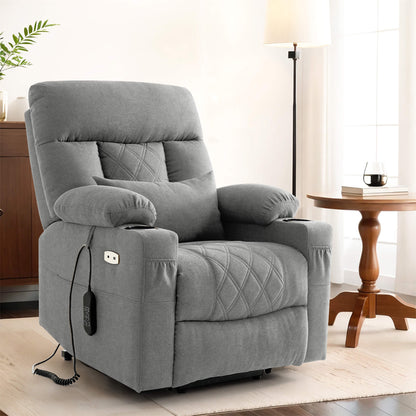 A light gray fabric power recliner chair with diamond-quilted stitching, shown in a bright living room.